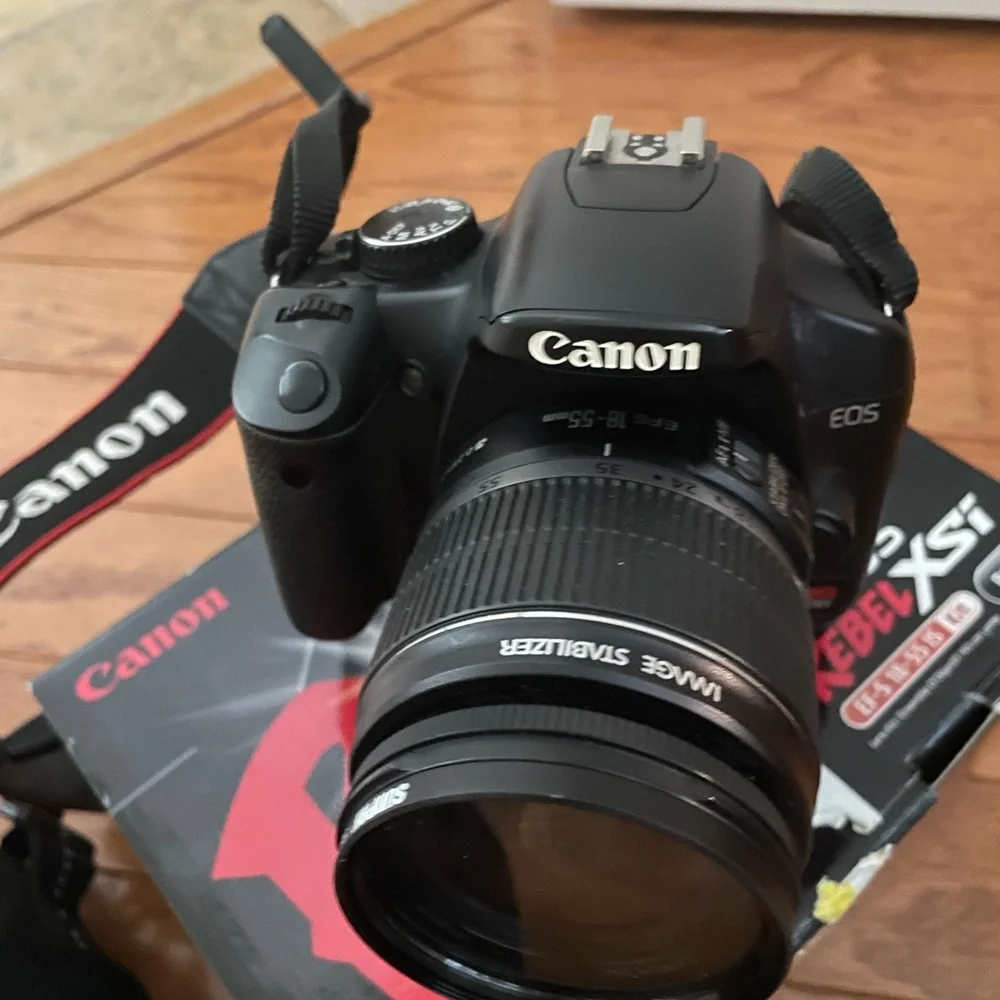 Canon Rebel Xsi DSLR camera with EF-S 18-55mm lens.